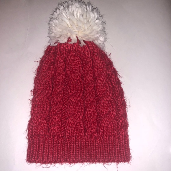 red and white pom pom hat